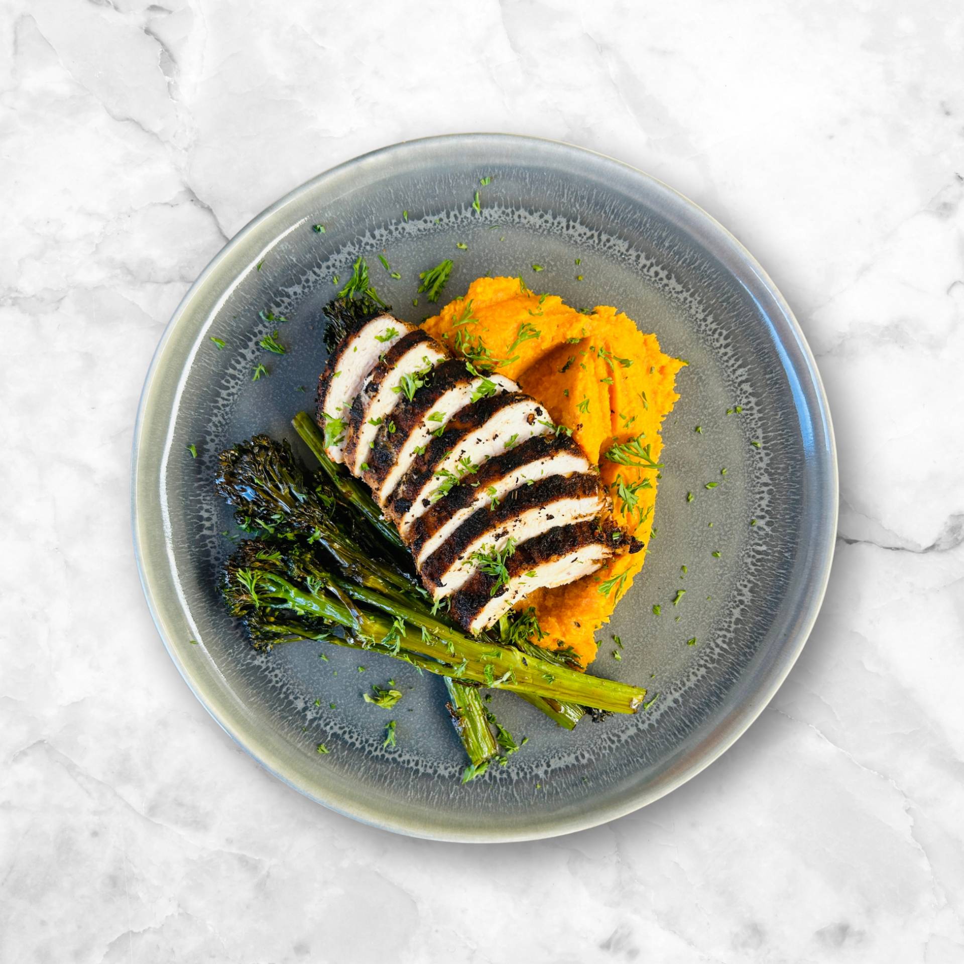 Seared Cajun Chicken, Sweet Potato Mash, Glazed Tender Stem Broccoli