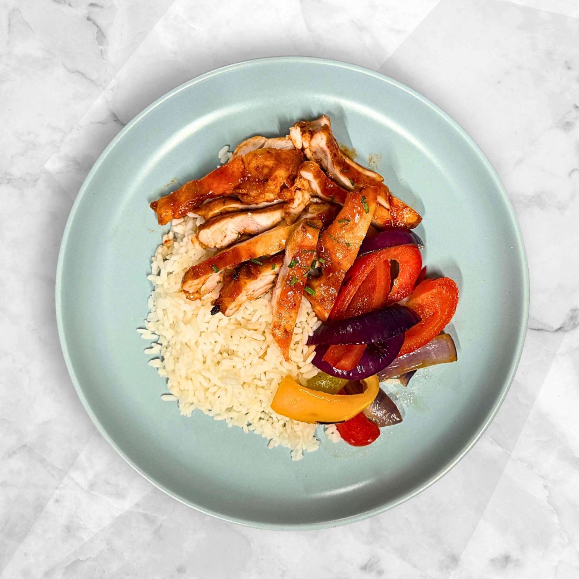 FIRECRACKER CHICKEN, STEAMED RICE, PEPPERS AND ONIONS